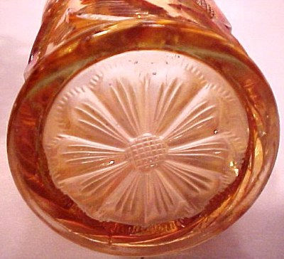 Flower in the design repeated on the base of tumbler