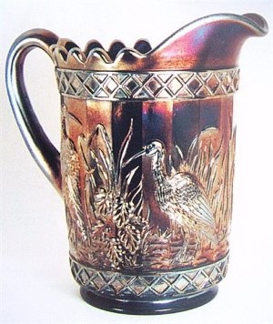 Stork in Rushes Pitcher displaying the Lattice Band design.