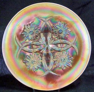 11 in. Peach Opal FOUR FLOWERS Chop Plate having smooth exterior.