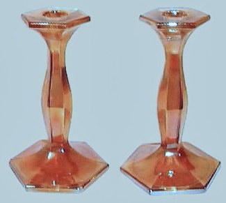 Fenton Candlesticks #249-six and on-half in. tall, circa 1921 in ruby stretch-style appears on pg. 63-Fenton Glass-First Twenty Five Years.