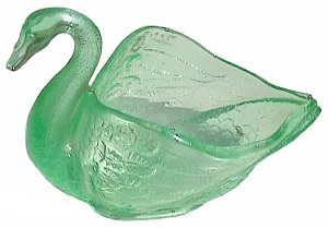 This Swan is vaseline base. It will glow under black light. 4.75 in. x 4 in. to top of head.