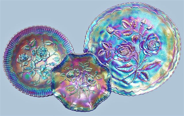 Face of LUSTRE ROSE,6 in.blue OPEN ROSE berry and the 9 in. OPEN ROSE plate in purple.