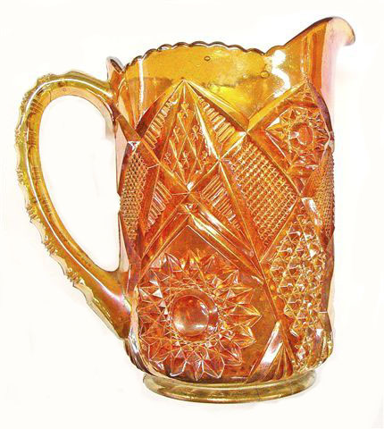 OMNIBUS Pitcher in amber base with marigold overlay.