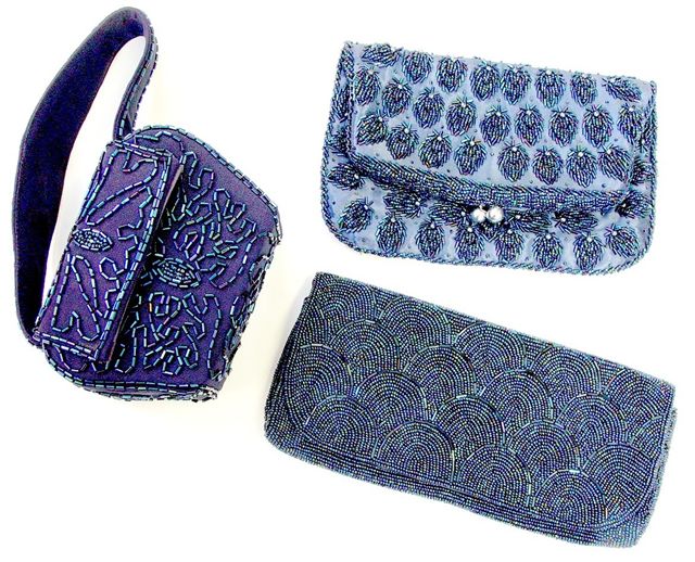 Purse on left is box style - two on the right are fold over type.These three sold for $110. at the May 28, '05 Wroda Sale