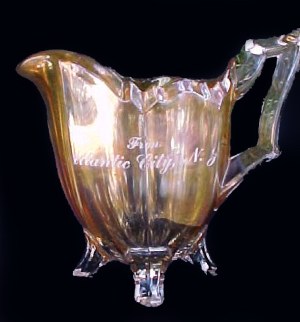 Marigold Carnival Glass Atlantic City Creamer in the Fluted Colonial or Quadruped pattern. 