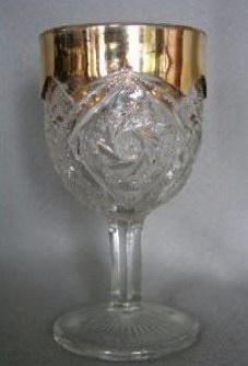 Double Pinwheel or Whirling Star wine with gold trim.